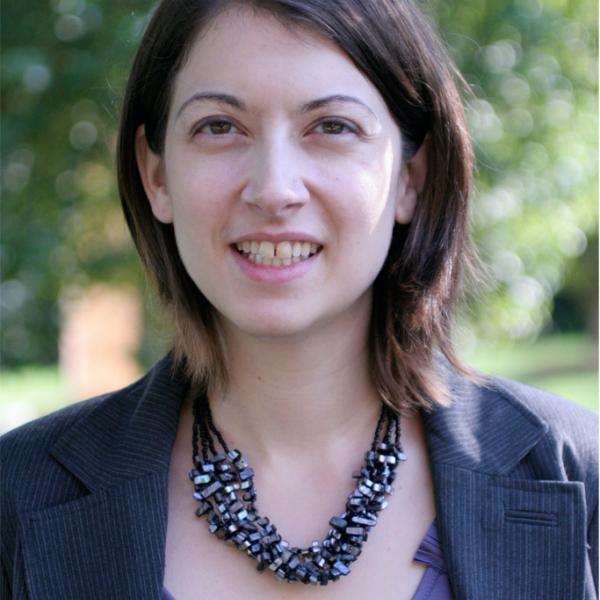 Portrait of Chelsea Foxwell standing outside in front of foliage