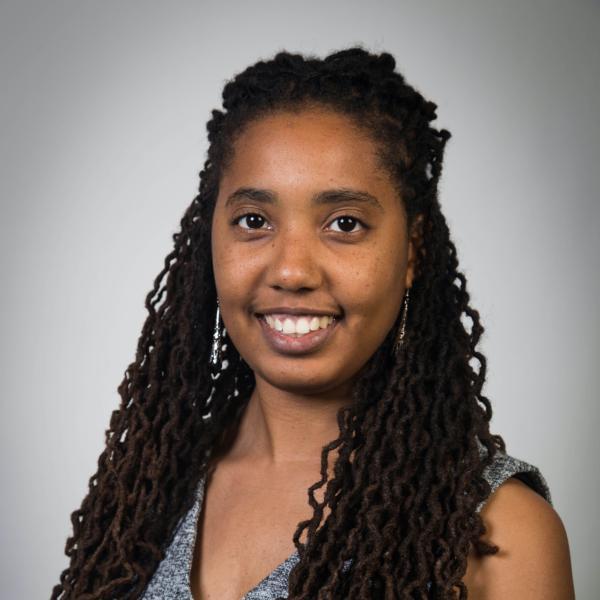Portrait of Danielle Roper in front of a grey vignette background